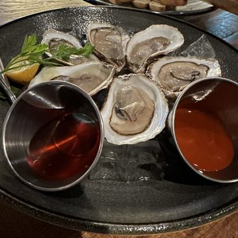 Birdog - a platter of oysters and sauces - American Near Me - Edmonton, Alberta Birdog - a platter of oysters and sauces - American Near Me - Edmonton, Alberta