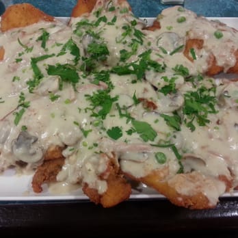 The Goni's Schnitzelria - Boscaiola schnitzel (peas, mushrooms, bacon in cream sauce) [no sense of scale here - is HUGE] - Spanish Near Me - Ramsgate, ACT