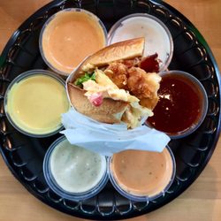 PDQ Chicken - Chicken Pimiento Cheese Sandwich Surrounded By Sauce