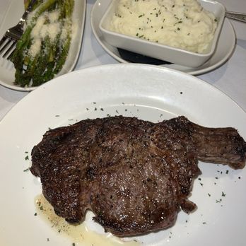Sullivan's Steakhouse - 22oz Cowboy Cut Ribeye with sides of garlic mashed potatoes and ASPARAGUS RISOTTO - Steakhouses Near Me - Charlotte, North Carolina Sullivan's Steakhouse - 22oz Cowboy Cut Ribeye with sides of garlic mashed potatoes and ASPARAGUS RISOTTO - Steakhouses Near Me - Charlotte, North Carolina
