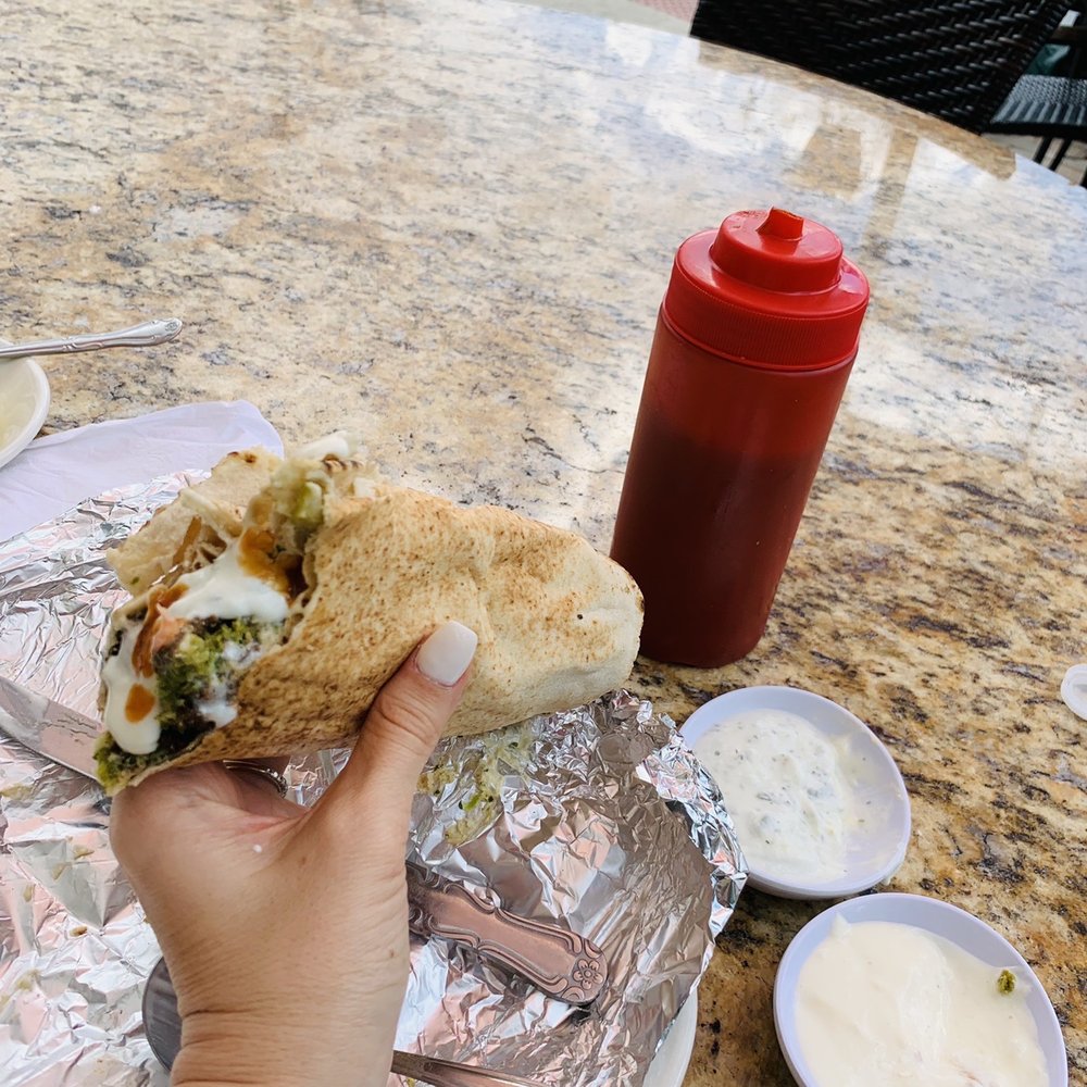 Flame Kabob - Falafel wrap. Add garlic sauce, tatziki and hot sauce for lots of flavor. - Middle Eastern Near Me - Orlando, Florida Flame Kabob - Falafel wrap. Add garlic sauce, tatziki and hot sauce for lots of flavor. - Middle Eastern Near Me - Orlando, Florida