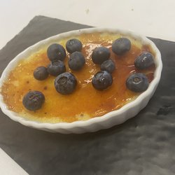 Home Town Hub - Vanilla crème brûlée with blueberry on top! Delicious! Nice crispy topping! Smooth and creamy not to sweet! Loved it