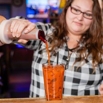 Eaton's Redwood - a woman pouring a drink - Bars Near Me - Elgin, Illinois Eaton's Redwood - a woman pouring a drink - Bars Near Me - Elgin, Illinois