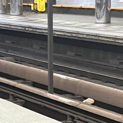 MARTA - Decatur Station - Cleaner sleeping on the platform