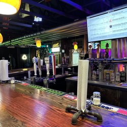 The Neighborhood Beer House - Bar view of taps.