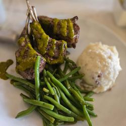 Grilled lamb chops with chimichurri sauce, green beans and mashed red potatoes