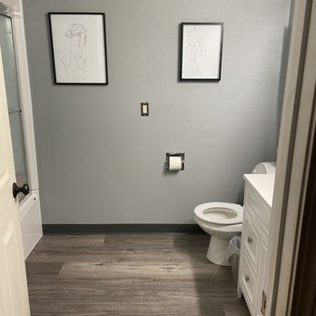 Leupitz Contractors - Overall view from the hall showing the beautiful new bathroom including the new paint, baseboards, and light plates. - General Contractors Near Me - Salem, Oregon