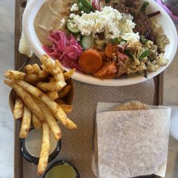 Salad with falafel and a side of pita & brassica fries