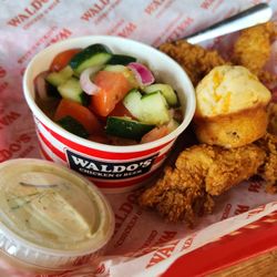 Waldo's Chicken & Beer - 3 piece tender with tomato-cucumber salad and a cheddar, jalepeño, bacon biscuit-ette.    #MyCameraEatsFirst