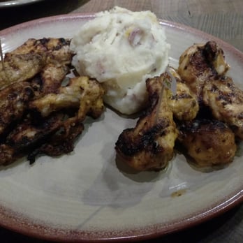 Nando's Peri-Peri - 12 chicken wings half mango lime/lemon herb side mashed potatoes - Chicken Shop Near Me - Chicago, Illinois