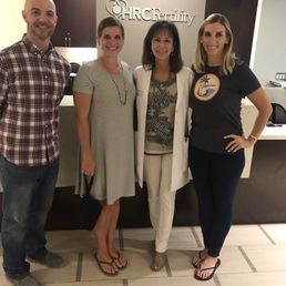 My husband josh, sister rachelle, Dr. Frederick and I when we were released to my ob after a successful implantation pregnancy.