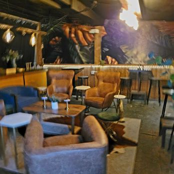 The Jasmine Bar - Comfortable chairs in the back room - Speakeasies Near Me - Louisville, Colorado