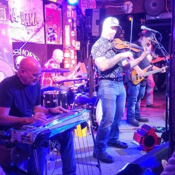 Flora-Bama Lounge, Package & Oyster Bar - Classically trained fiddle player in the band. - Music Venues Near Me - Pensacola, Florida Flora-Bama Lounge, Package & Oyster Bar - Classically trained fiddle player in the band. - Music Venues Near Me - Pensacola, Florida