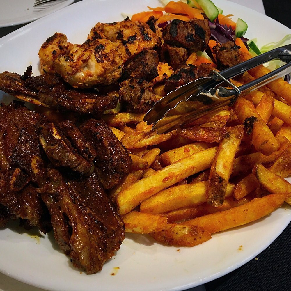 Simba Grill - Mixed grill plate - bbq ribs, chicken and beef mishkaki and masala fries - Indian Near Me - East York, Ontario Simba Grill - Mixed grill plate - bbq ribs, chicken and beef mishkaki and masala fries - Indian Near Me - East York, Ontario