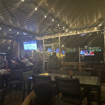 Woodson's Local Tap + Kitchen Grand Parkway - Patio - American Near Me - Spring, Texas Woodson's Local Tap + Kitchen Grand Parkway - Patio - American Near Me - Spring, Texas