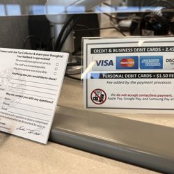 Sarasota County Tax Collector - 2.45% additional fee for using Credit Card and $1.50 charge for using debit cards, also you can fill out a customer satisfaction card