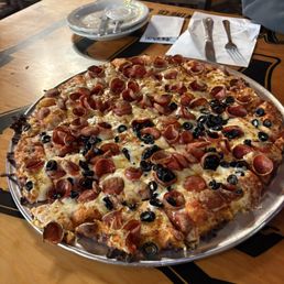 Pepperoni/olive pizza cut into ridiculously small pieces.