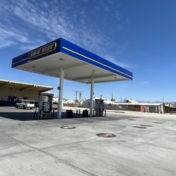 Kwik Serve - Flat parking lot with 2 entrances