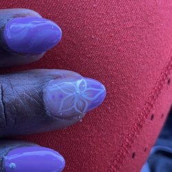 Angel Nails Sarasota  - This flower design was ok but the glitter in the middle was done with proper technique.