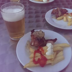 Lucy - Costillas a la brasa con cebolla caramelizada
