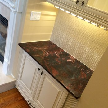 Dasa Design Build - a kitchen with a fireplace and cabinets - General Contractors Near Me - Nutley, New Jersey Dasa Design Build - a kitchen with a fireplace and cabinets - General Contractors Near Me - Nutley, New Jersey