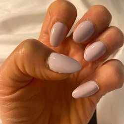 Ryna's Nails - Color on the cuticle, the shape of the nail is uneven, worst experience had. Very unfriendly and unprofessional