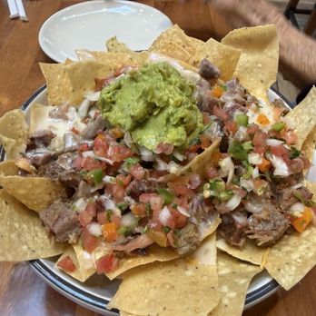 Three Wide Brewing - Loaded Nachos - Corn Chips, Smoked Brisket, Hatch Chili Queso, Shred Cheese, Fresh Jalapenos, Pico, Guac. Sooo good - Breweries Near Me - Northlake, Texas Three Wide Brewing - Loaded Nachos - Corn Chips, Smoked Brisket, Hatch Chili Queso, Shred Cheese, Fresh Jalapenos, Pico, Guac. Sooo good - Breweries Near Me - Northlake, Texas