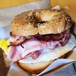 The Latte Cafe & Bakery - Breakfast sandwich with egg, ham, bacon on everything bagel.