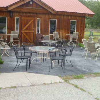 The Ranch - a patio with tables and chairs - Steakhouses Near Me - Carmen, Idaho The Ranch - a patio with tables and chairs - Steakhouses Near Me - Carmen, Idaho
