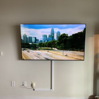 Premwire Tech Solutions - 65 inch tv mounted with strip Premwire, Charlotte, NC. - Home Theatre Installation Near Me