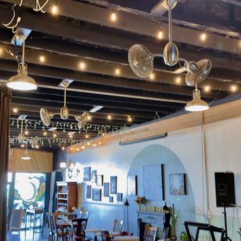 Moon Brew Coffee - High angle photo from back of the coffeehouse, looking towards the front of the store. Carefully curated art for sale by local artists. - Coffee & Tea Near Me - Rockdale, Texas