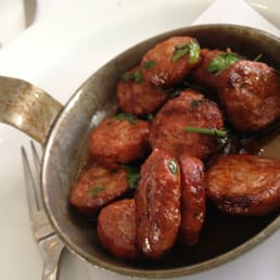 Pan fries chorizo with basil and mint. Pan fries chorizo with basil and mint.