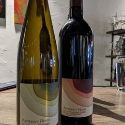 two bottles of wine on a table