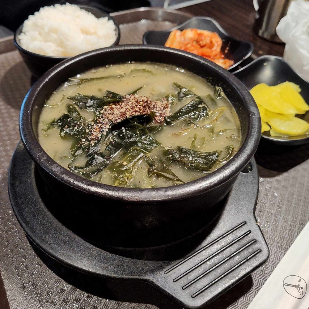Seaweed soup with a side of rice, fresh kimchi and pickled radish Seaweed soup with a side of rice, fresh kimchi and pickled radish