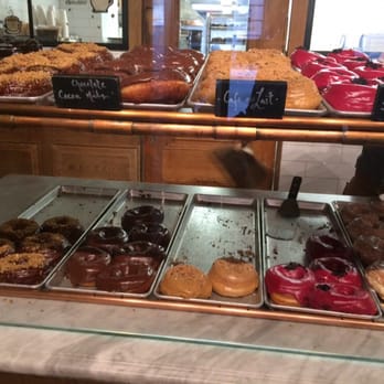 Dough - Shelf-full of doughnuts - Desserts Near Me - New York, New York