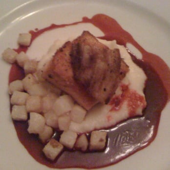The Kitchen Table - Half a portion of Salmon with pork belly, celery root cubes, all on mashed potatoes - New American Near Me - Richmond, Vermont