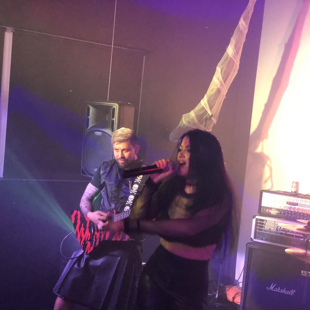 Poison Lips Band - a man and a woman on stage - Musicians Near Me Poison Lips Band - a man and a woman on stage - Musicians Near Me