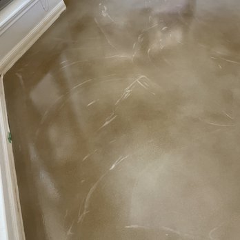 Stain Tech - Scratch marks that show the sander made grooves in the flooring where the acid stain didn't take and left big white scratches in the floor. - Flooring Near Me - San Antonio, Texas Stain Tech - Scratch marks that show the sander made grooves in the flooring where the acid stain didn't take and left big white scratches in the floor. - Flooring Near Me - San Antonio, Texas