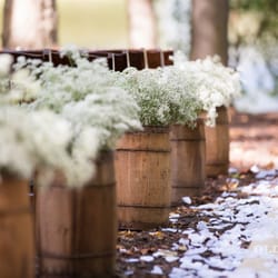 Chapel in the Woods - Rustic wedding decor small nail kegs or barrels.