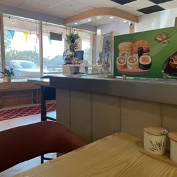 Conveyor belt with wasabi, soy sauce and ginger on the table Conveyor belt with wasabi, soy sauce and ginger on the table