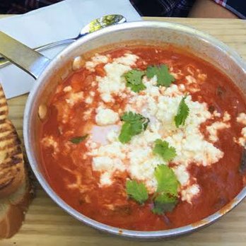Tatte Bakery & Cafe | Beacon St - Tatte's Shakshuka. Made with tomato, egg, and cheese, it's a tasty dish that is not too spicy that comes with two wonderful slices of bread. - Bakeries Near Me - Brookline, Massachusetts Tatte Bakery & Cafe | Beacon St - Tatte's Shakshuka. Made with tomato, egg, and cheese, it's a tasty dish that is not too spicy that comes with two wonderful slices of bread. - Bakeries Near Me - Brookline, Massachusetts