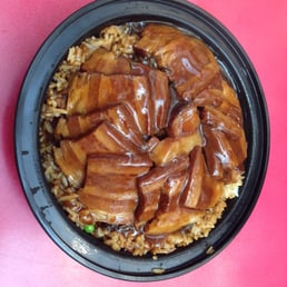 Pork belly with mustard greens over rice
