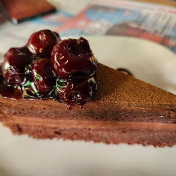 Cafe McQueen - Chocolate Cake at Cafe McQueen in 2026. - Bars Near Me - Prague, Puerto Rico Cafe McQueen - Chocolate Cake at Cafe McQueen in 2026. - Bars Near Me - Prague, Puerto Rico