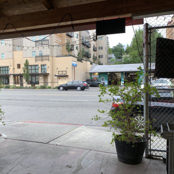 Man'oushe Express - Lil covered patio with 2 benches - Pizza Near Me - Seattle, Washington Man'oushe Express - Lil covered patio with 2 benches - Pizza Near Me - Seattle, Washington