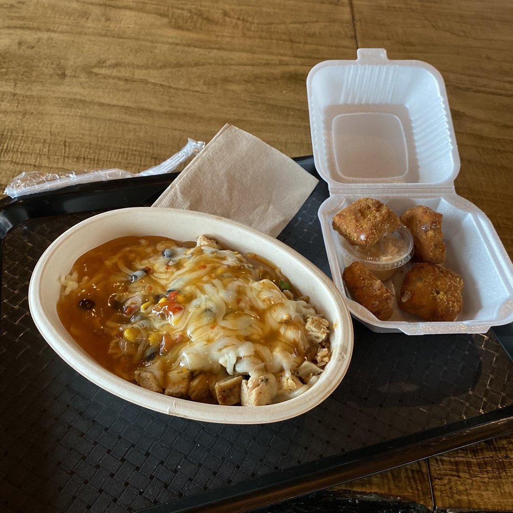 A chicken and rice bowl with Asian ginger sauce. A chicken and rice bowl with Asian ginger sauce.