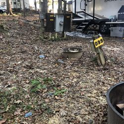 Lake Myers Campground - Typical power and water pedestal! Notice fire ring that was full of trash! Luckily we found an unused ring that we were able to use.