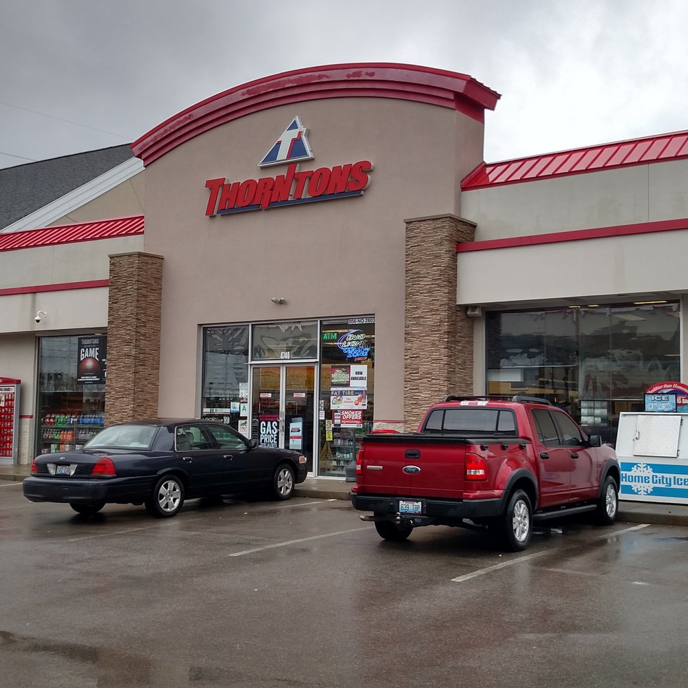 cars parked in front of a store cars parked in front of a store
