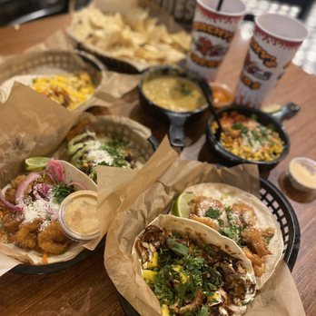 Torchy's Tacos - Jerk chicken, couple Baja shrimp, salmon, chicken fajita, street corn & queso - Tacos Near Me - Fort Worth, Texas