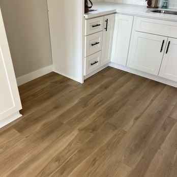 Family Interiors - Kitchen flooring with trim even behind the stove and refrigerator - Shades & Blinds Near Me - El Cajon, California Family Interiors - Kitchen flooring with trim even behind the stove and refrigerator - Shades & Blinds Near Me - El Cajon, California