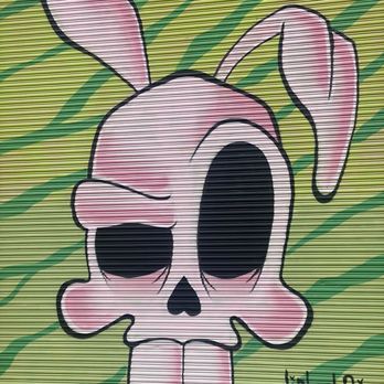 Dragon School murals - Pink rabbit skull pondering moves. Has big eye for a major event. - Public Art Near Me - Oakland, California Dragon School murals - Pink rabbit skull pondering moves. Has big eye for a major event. - Public Art Near Me - Oakland, California